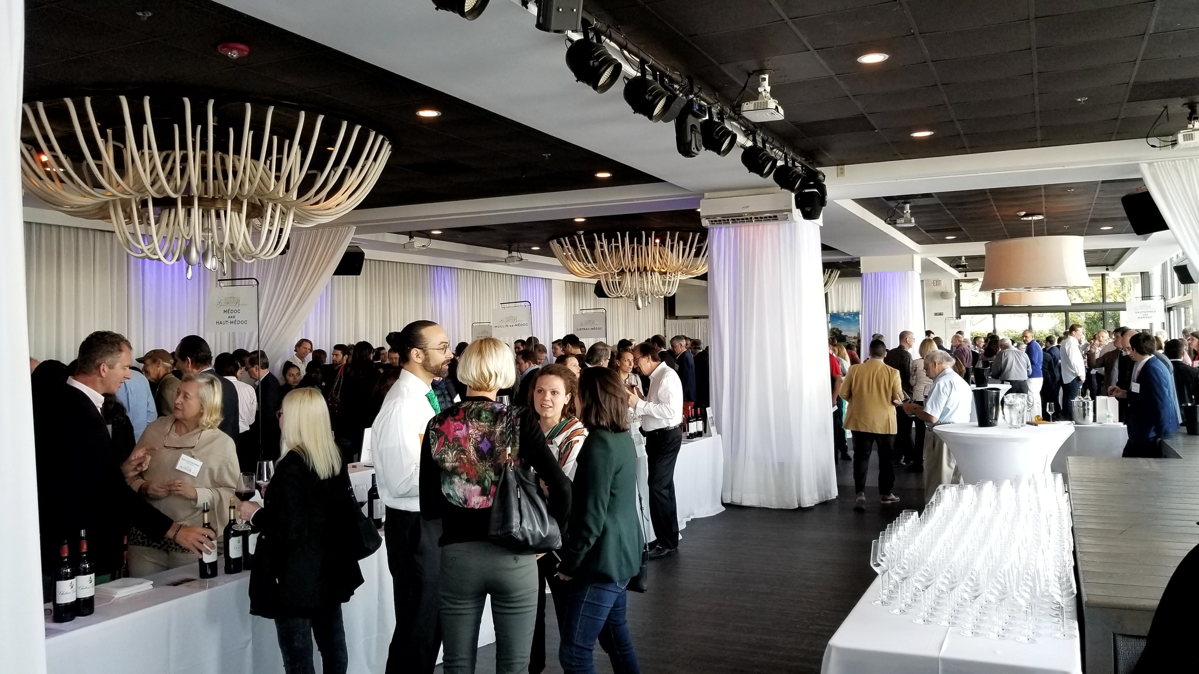 Guests networking at a wine tasting event